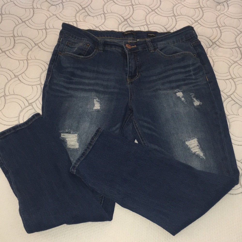Supplies distressed straight jeans. Size 14